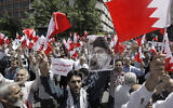 Illustrative: Iranians wave Bahraini flags as they chant slogans during a demonstration in Tehran, Iran, May 18, 2012 (AP Photo/Vahid Salemi)