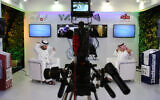 Illustrative: An Emirati television anchor and his guest prepare for a program at the Arab Media Forum in Dubai, United Arab Emirates, May 10, 2016. (AP Photo/Kamran Jebreili)