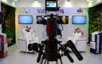 Illustrative: An Emirati television anchor and his guest prepare for a program at the Arab Media Forum in Dubai, United Arab Emirates, May 10, 2016. (AP Photo/Kamran Jebreili)