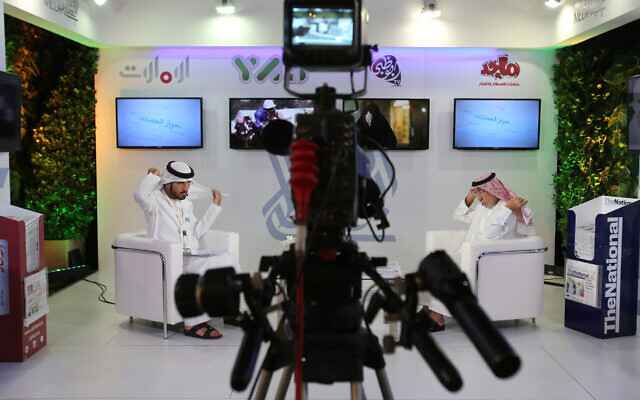 Illustrative: An Emirati television anchor and his guest prepare for a program at the Arab Media Forum in Dubai, United Arab Emirates, May 10, 2016. (AP Photo/Kamran Jebreili) Illustrative: An Emirati television anchor and his guest prepare for a program at the Arab Media Forum in Dubai, United Arab Emirates, May 10, 2016. (AP Photo/Kamran Jebreili)