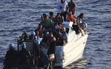Illustrative: A Brazilian Navy motor boat from the United Nations Interim Force in Lebanon (UNIFIL) approaches a boat overcrowded with migrants in the Mediterranean Sea, October 11, 2018. (UNIFIL via AP)