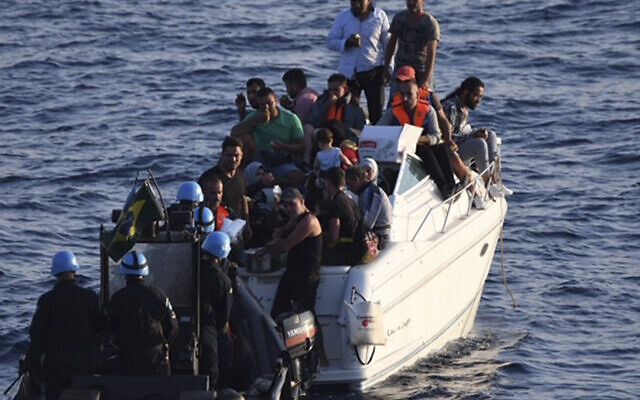 Illustrative: A Brazilian Navy motor boat from the United Nations Interim Force in Lebanon (UNIFIL) approaches a boat overcrowded with migrants in the Mediterranean Sea, October 11, 2018. (UNIFIL via AP) Illustrative: A Brazilian Navy motor boat from the United Nations Interim Force in Lebanon (UNIFIL) approaches a boat overcrowded with migrants in the Mediterranean Sea, October 11, 2018. (UNIFIL via AP)