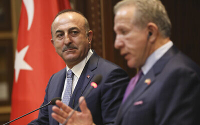 Turkish Foreign Minister Mevlut Cavusoglu, left, listens to his Kosovo counterpart Behxhet Pacolli during a joint press conference in Pristina, Kosovo on October 19, 2018. (AP Photo/Visar Kryeziu)