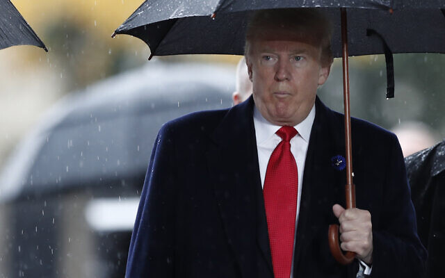 US President Donald Trump arrives to attend a commemoration ceremony for Armistice Day, 100 years after the end of the First World War at the Arc de Triomphe in Paris, France, Sunday, November 11, 2018. (Benoit Tessier/Pool Photo via AP) US President Donald Trump arrives to attend a commemoration ceremony for Armistice Day, 100 years after the end of the First World War at the Arc de Triomphe in Paris, France, Sunday, November 11, 2018. (Benoit Tessier/Pool Photo via AP)
