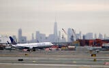 A United Airlines jet prepares touches down at Newark Liberty International Airport  on Jan. 23, 2019, in Newark, N.J. (AP Photo/Julio Cortez)