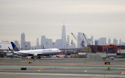 A United Airlines jet prepares touches down at Newark Liberty International Airport on Jan. 23, 2019, in Newark, N.J. (AP Photo/Julio Cortez) A United Airlines jet prepares touches down at Newark Liberty International Airport on Jan. 23, 2019, in Newark, N.J. (AP Photo/Julio Cortez)