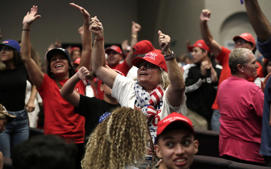 Supporters of US President Donald Trump during a rally for evangelical supporters at the King Jesus International Ministry, Jan. 3, 2020, in Miami. (AP Photo/Lynne Sladky) Supporters of US President Donald Trump during a rally for evangelical supporters at the King Jesus International Ministry, Jan. 3, 2020, in Miami. (AP Photo/Lynne Sladky)