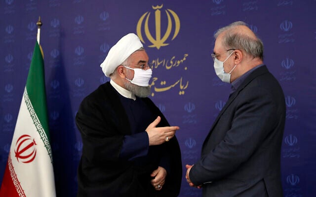 In this photo released by the official website of the office of the Iranian Presidency, President Hassan Rouhani, left, talks with his Minister of Health and Medical Education Saeed Namaki during a meeting in Tehran, Iran, Saturday, July 4, 2020. (Iranian Presidency Office via AP) In this photo released by the official website of the office of the Iranian Presidency, President Hassan Rouhani, left, talks with his Minister of Health and Medical Education Saeed Namaki during a meeting in Tehran, Iran, Saturday, July 4, 2020. (Iranian Presidency Office via AP)