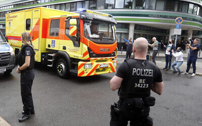 An ambulance believed to transporting Alexei Navalny arrives at the Charite hospital in Berlin, Germany, August 22, 2020. (AP Photo/Markus Schreiber)