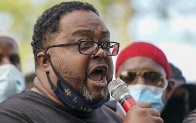 Jacob Blake's father, Jacob Blake Sr. talks to a crowd at a rally Saturday, Aug. 29, 2020, in Kenosha, Wis. (AP Photo/Morry Gash)