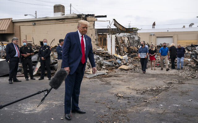 President Donald Trump tours an area Tuesday, Sept. 1, 2020, that damaged during demonstrations after a police officer shot Jacob Blake in Kenosha, Wis. (AP/Evan Vucci) President Donald Trump tours an area Tuesday, Sept. 1, 2020, that damaged during demonstrations after a police officer shot Jacob Blake in Kenosha, Wis. (AP/Evan Vucci)