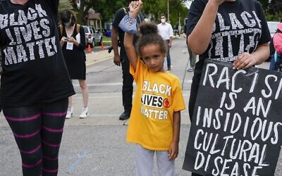 6-year-old Deja at a Black Lives Matter protest, September 1, 2020, in Kenosha, Wisconsin. (AP/Morry Gash)