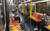 Illustrative: People in face masks ride the subway in Manhattan during the coronavirus pandemic, Aug. 27, 2020 in New York. (AP Photo/Ted Shaffrey)