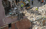 Rescuers search at the site of a collapsed building after getting signals there may be a survivor under the rubble, in Beirut, Lebanon, Sept. 5, 2020 (AP Photo/Hassan Ammar)