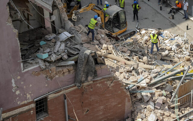 Rescuers search at the site of a collapsed building after getting signals there may be a survivor under the rubble, in Beirut, Lebanon, Sept. 5, 2020 (AP Photo/Hassan Ammar) Rescuers search at the site of a collapsed building after getting signals there may be a survivor under the rubble, in Beirut, Lebanon, Sept. 5, 2020 (AP Photo/Hassan Ammar)