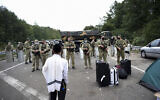 Ukrainian border guards block the road to Jewish pilgrims on the Belarus-Ukraine border, in Belarus, September 15, 2020. (TUT.by via AP)