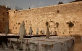 Capsules for up to 20 women to worship, a measure to curb the spread of the coronavirus, at the Western Wall in the Old City of Jerusalem, sit empty on Sept. 18, 2020, on the first day of a nationwide three-week lockdown in reaction to a resurgence in COVID-19 cases. (AP Photo/Maya Alleruzzo)