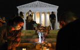 People gather at the Supreme Court Sept. 18, 2020, in Washington, after the Supreme Court announced that Supreme Court Justice Ruth Bader Ginsburg died of metastatic pancreatic cancer at age 87. (AP Photo/Alex Brandon)