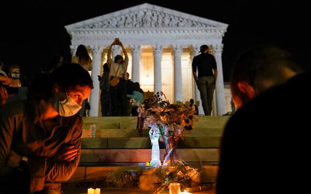 People gather at the Supreme Court Sept. 18, 2020, in Washington, after the Supreme Court announced that Supreme Court Justice Ruth Bader Ginsburg died of metastatic pancreatic cancer at age 87. (AP Photo/Alex Brandon) People gather at the Supreme Court Sept. 18, 2020, in Washington, after the Supreme Court announced that Supreme Court Justice Ruth Bader Ginsburg died of metastatic pancreatic cancer at age 87. (AP Photo/Alex Brandon)