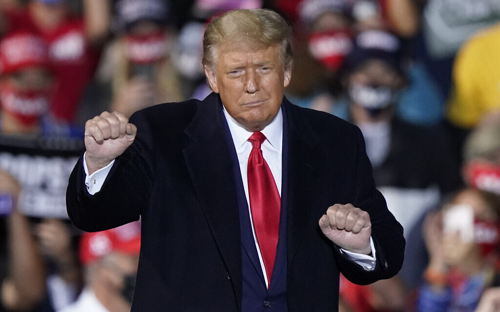 US President Donald Trump dances with the music after speaking at a campaign rally, in Swanton, Ohio, September 21, 2020. (Tony Dejak/AP) US President Donald Trump dances with the music after speaking at a campaign rally, in Swanton, Ohio, September 21, 2020. (Tony Dejak/AP)
