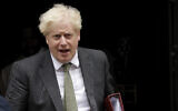 British Prime Minister Boris Johnson leaves 10 Downing Street in London, to attend the weekly Prime Minister's Questions at the Houses of Parliament, in London, Sept. 23, 2020 (AP Photo/Matt Dunham)