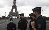 French police officers secure the bridge leading to the Eiffel Tower, September 23, 2020 in Paris. (AP Photo/Michel Euler)