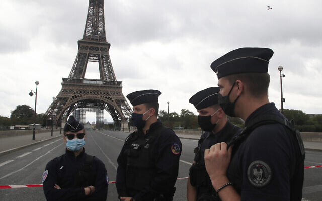 French police officers secure the bridge leading to the Eiffel Tower, September 23, 2020 in Paris. (AP Photo/Michel Euler) French police officers secure the bridge leading to the Eiffel Tower, September 23, 2020 in Paris. (AP Photo/Michel Euler)