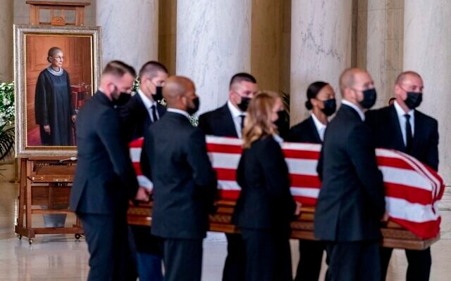 The flag-draped casket of Justice Ruth Bader Ginsburg, carried by Supreme Court police officers, arrives in the Great Hall at the Supreme Court in Washington, September 23, 2020. (AP Photo/Andrew Harnik, Pool) The flag-draped casket of Justice Ruth Bader Ginsburg, carried by Supreme Court police officers, arrives in the Great Hall at the Supreme Court in Washington, September 23, 2020. (AP Photo/Andrew Harnik, Pool)