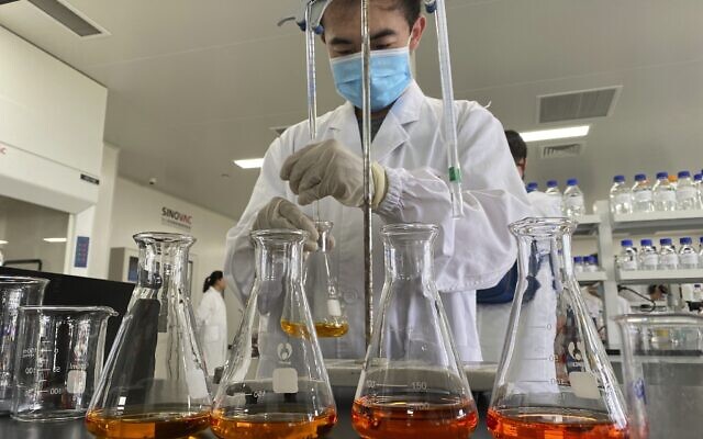 A worker inside a lab at the SinoVac vaccine factory in Beijing on September 24, 2020. (AP/Ng Han Guan) A worker inside a lab at the SinoVac vaccine factory in Beijing on September 24, 2020. (AP/Ng Han Guan)