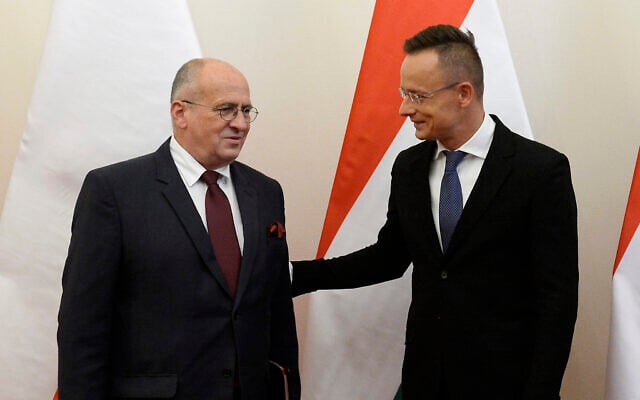 Hungarian Minister of Foreign Affairs and Trade Peter Szijjarto, right, welcomes his Polish counterpart, Zbigniew Rau in the Ministry of Foreign Affairs and Trade in Budapest, Hungary, Monday, September 28, 2020. (Lajos Soos/MTI via AP) Hungarian Minister of Foreign Affairs and Trade Peter Szijjarto, right, welcomes his Polish counterpart, Zbigniew Rau in the Ministry of Foreign Affairs and Trade in Budapest, Hungary, Monday, September 28, 2020. (Lajos Soos/MTI via AP)