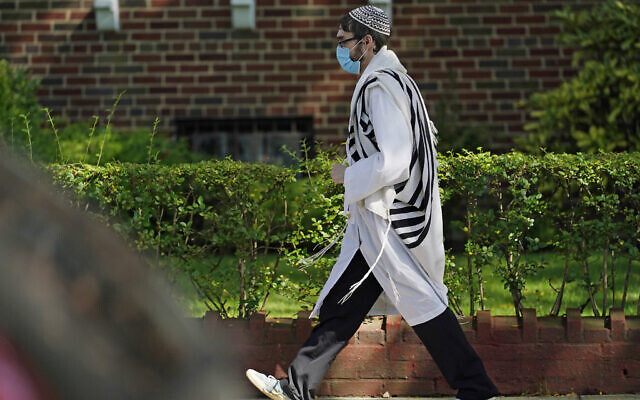 Illustrative: A Jewish man  walks through the Midwood neighborhood of Brooklyn, Monday, Sept. 28, 2020, in New York (AP Photo/Kathy Willens)
