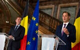 Belgian Minister of Cooperation Development and Finance, Alexander De Croo, right, and Belgian francophone Socialist Party chairman, Paul Magnette attend a media conference at the Egmont Palace in Brussels, Wednesday, Sept. 30, 2020. Almost 500 days after Belgian parliamentary elections, seven parties from both sides of the linguistic border have agreed on forming a fully functioning majority government that will center on dealing with the pandemic and its devastating economic impact. (AP Photo/Virginia Mayo)