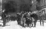 A group of Polish Jews are led away for deportation by German SS soldiers, in April/May 1943, during the destruction of the Warsaw Ghetto by German troops after an uprising in the Jewish quarter, 1943. (AP Photo)