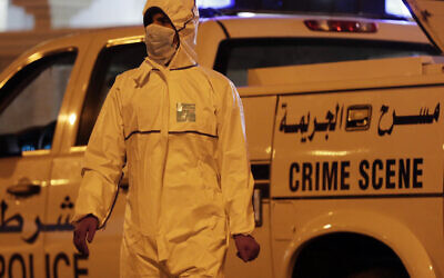 Illustrative: Police collect evidence at the scene where a police officer was killed in Karbabad Village, Bahrain, Saturday, April 16, 2016.  (AP Photo/Hasan Jamali)