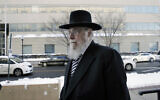 In a Wednesday, Feb. 18, 2015 file photo, Rabbi Mendel Epstein, right, arrives for his trial at federal court in Trenton, New Jersey (AP Photo/Mel Evans)