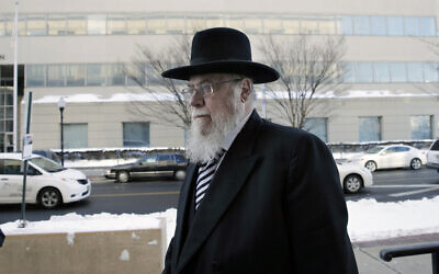 In a Wednesday, Feb. 18, 2015 file photo, Rabbi Mendel Epstein, right, arrives for his trial at federal court in Trenton, New Jersey (AP Photo/Mel Evans)