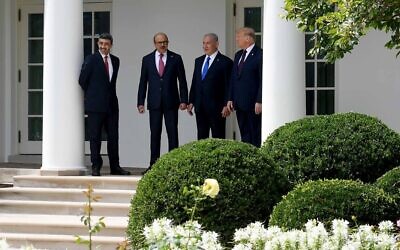 L-R: UAE Foreign Minister Abdullah bin Zayed Al-Nahyan, Bahrain Foreign Minister Abdullatif al-Zayani, Israeli Prime Minister Benjamin Netanyahu and US President Donald Trump talk at the ceremony for the signing of the Abraham Accords, at the White House in Washington, DC, September 15, 2020. (Avi Ohayon / GPO)