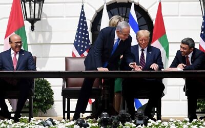 Bahrain Foreign Minister Abdullatif al-Zayani, Israeli Prime Minister Benjamin Netanyahu, US President Donald Trump and the United Arab Emirates' Foreign Minister Abdullah bin Zayed bin Sultan Al Nahyan sign the normalization agreements between the countries on the South Lawn of the White House, September 15, 2020 (Avi Ohayon / GPO)