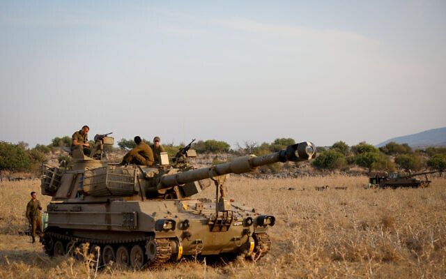 Israeli army forces seen stationed near the border between Israel and Lebanon in the Golan Heights on July 27, 2020. (David Cohen/Flash90) Israeli army forces seen stationed near the border between Israel and Lebanon in the Golan Heights on July 27, 2020. (David Cohen/Flash90)