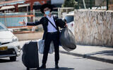 Illustrative photo: A student moving into the Hebron Yeshiva in Jerusalem on August 18, 2020. (Yonatan Sindel/Flash90)