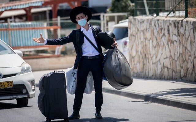 Illustrative photo: A student moving into the Hebron Yeshiva in Jerusalem on August 18, 2020. (Yonatan Sindel/Flash90) Illustrative photo: A student moving into the Hebron Yeshiva in Jerusalem on August 18, 2020. (Yonatan Sindel/Flash90)