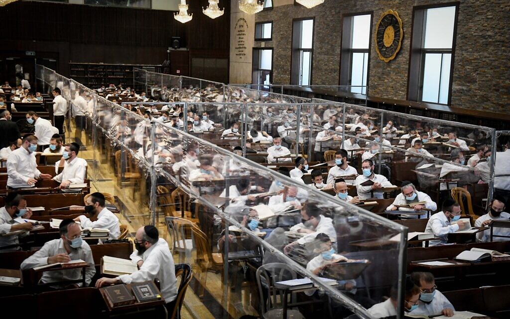 Ultra-Orthodox Jewish men study Torah in small 'capsule' groups at the Ateret Shlomo Yeshiva in the city of Modiin Illit, August 24, 2020. (Yossi Zeliger/Flash90) Ultra-Orthodox Jewish men study Torah in small 'capsule' groups at the Ateret Shlomo Yeshiva in the city of Modiin Illit, August 24, 2020. (Yossi Zeliger/Flash90)