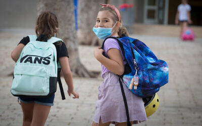 Young Israeli students on their first day back at school, at Gavrieli school, in Tel Aviv, September 01, 2020 (Miriam Alster/Flash90)