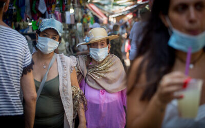 Israelis wear protective face masks in Tel Aviv on September 2, 2020. (Miriam Alster/Flash90)