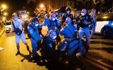 Police arrest a man who drove toward police and demonstrators during a protest against Prime Minister Benjamin Netanyahu, outside the PM's official residence in Jerusalem, on September 20, 2020. (Yonatan Sindel/Flash90)