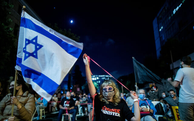 Following social-distancing regulations, protesters rally against Prime Minister Benjamin Netanyahu, outside his official residence in Jerusalem on September 24, 2020. (Yonatan Sindel/Flash90) Following social-distancing regulations, protesters rally against Prime Minister Benjamin Netanyahu, outside his official residence in Jerusalem on September 24, 2020. (Yonatan Sindel/Flash90)