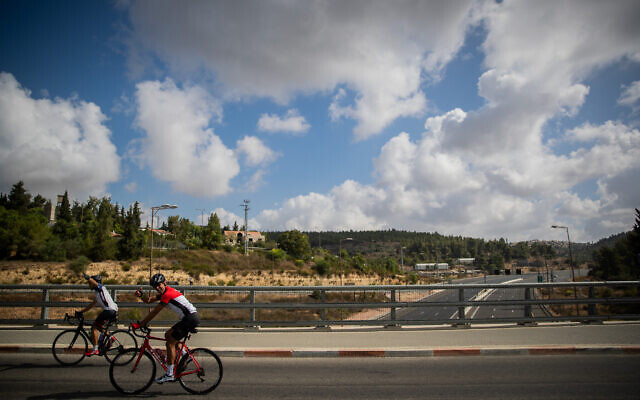 Israelis ride their bicycles outside Jerusalem on September 26, 2020 (Yonatan Sindel/Flash90)