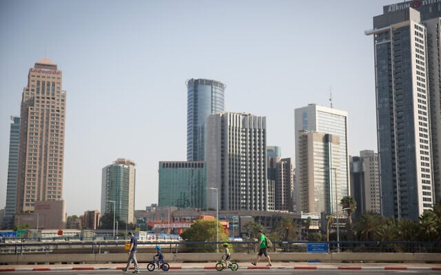 Israelis ride their bicycles along the empty Ayalon highway in Tel Aviv, on Yom Kippur, September 28, 2020 (Miriam Alster/Flash 90) Israelis ride their bicycles along the empty Ayalon highway in Tel Aviv, on Yom Kippur, September 28, 2020 (Miriam Alster/Flash 90)