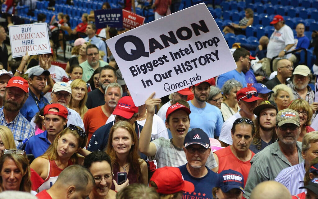 Trump supporters displaying QAnon posters appeared at US President Donald Trump’s rally, July 31, 2018 at the Florida State Fair Grounds in Tampa Florida (Thomas O'Neill/NurPhoto via JTA) Trump supporters displaying QAnon posters appeared at US President Donald Trump’s rally, July 31, 2018 at the Florida State Fair Grounds in Tampa Florida (Thomas O'Neill/NurPhoto via JTA)