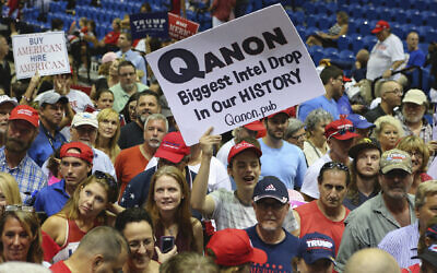 Trump supporters displaying QAnon posters appeared at US President Donald Trump’s rally, July 31, 2018 at the Florida State Fair Grounds in Tampa Florida (Thomas O'Neill/NurPhoto via JTA)